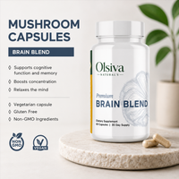Olsiva Naturals Mushroom Capsules Brain Blend supplement bottle displayed on a marble pedestal with two capsules beside it, alongside product benefits text and non-GMO/vegan badges.